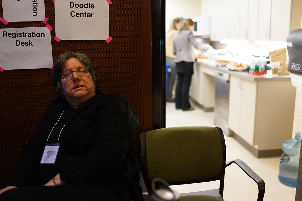 Attendees pause for coffee and conversation during a short break between sessions.