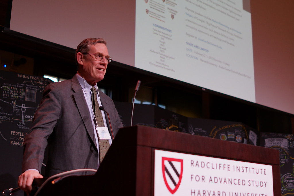 Professor Peter Bol gestures mid-talk while presenting on mapping historical data.